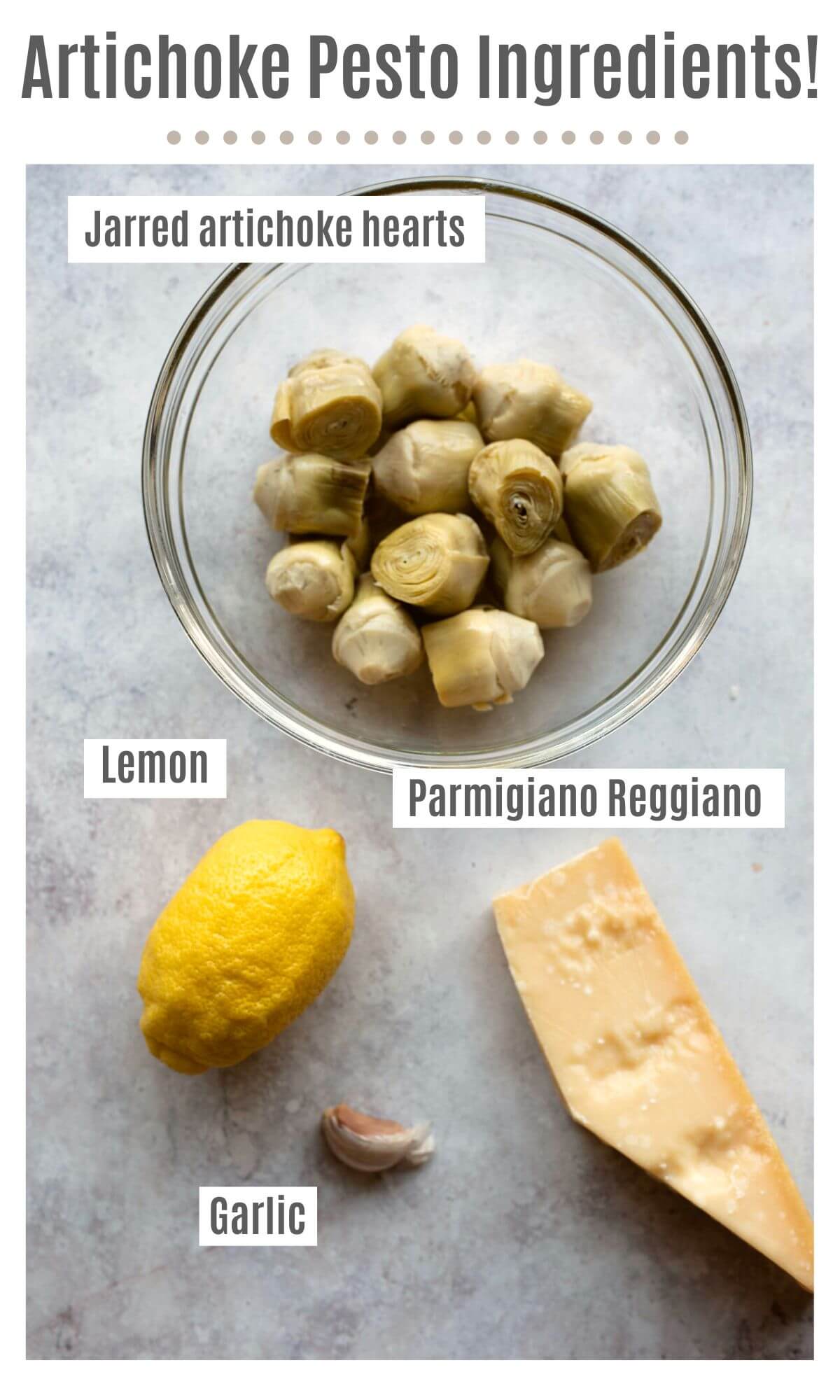 An overhead shot of labelled ingredients needed to make artichoke pesto; jarred artichoke hearts, lemon, Parmigiano Reggiano and garlic.