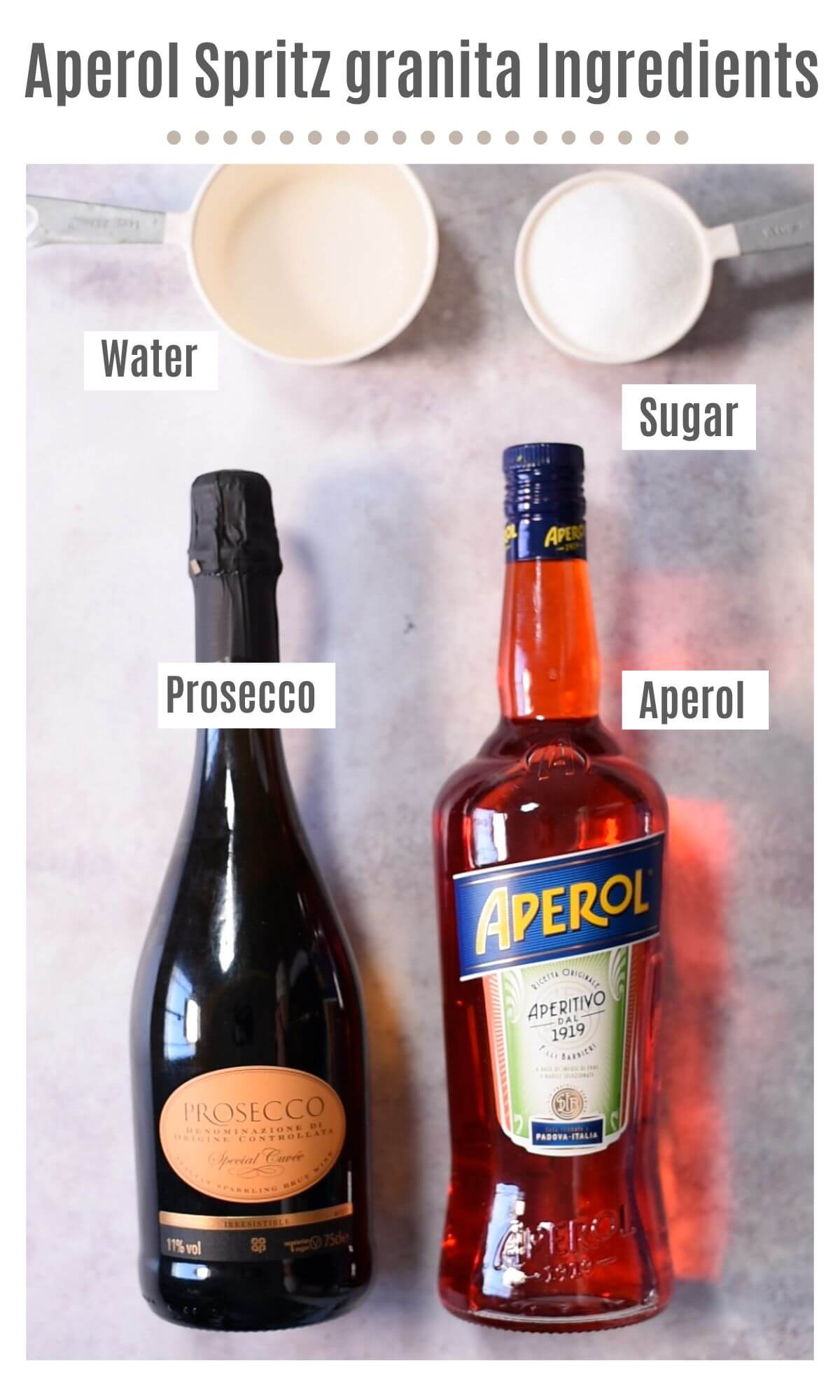 An overhead shot of all the ingredients you need to make Aperol Spritz granita.