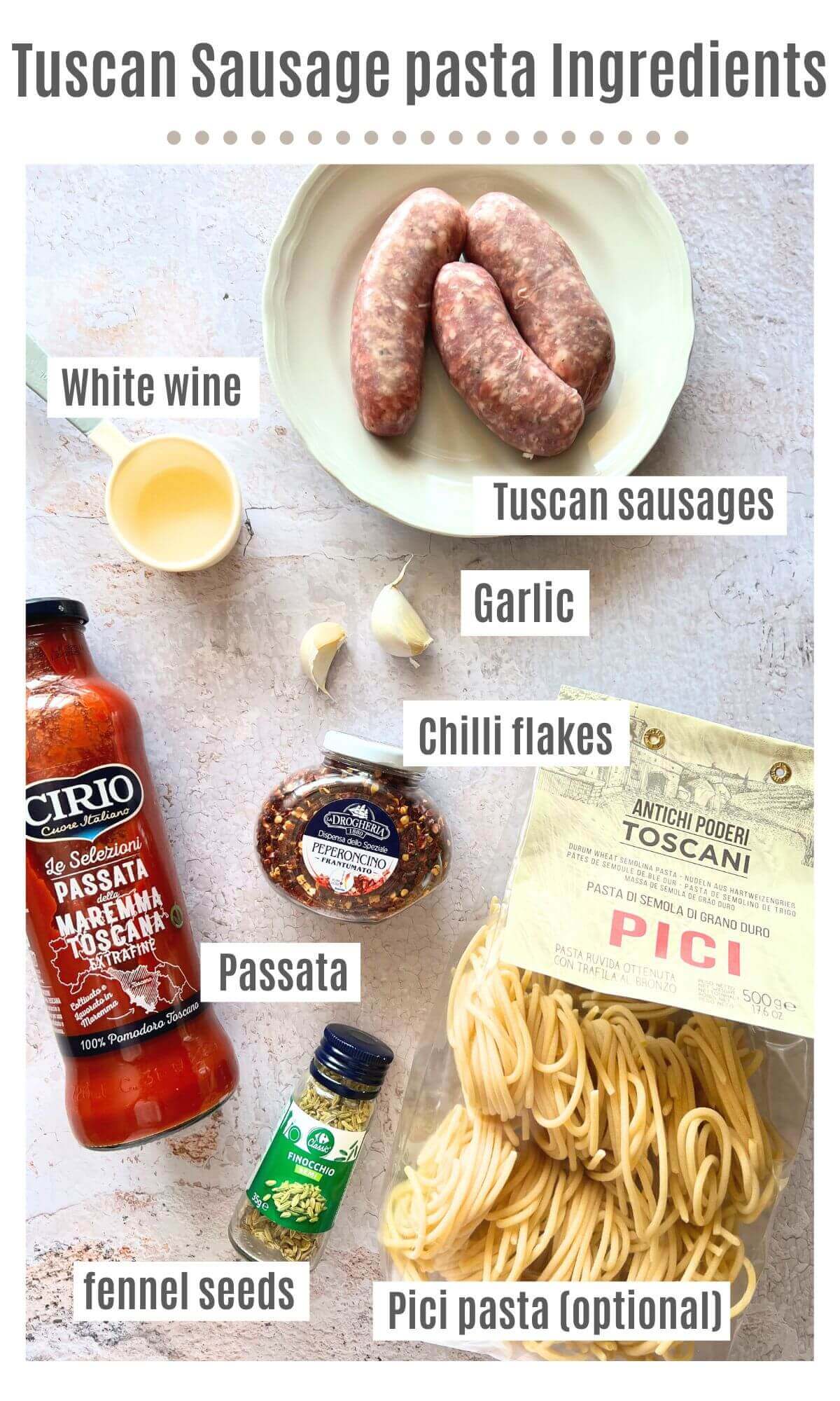 An overhead shot of all the ingredients needed to make Tuscan sausage pasta.