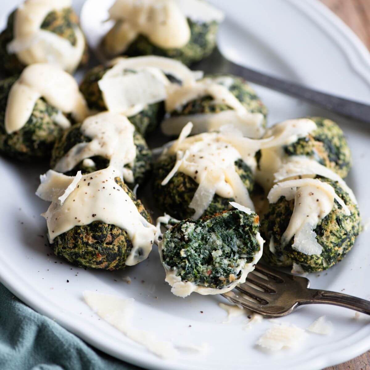 Baked Spinach Balls with Parmigiano Cream