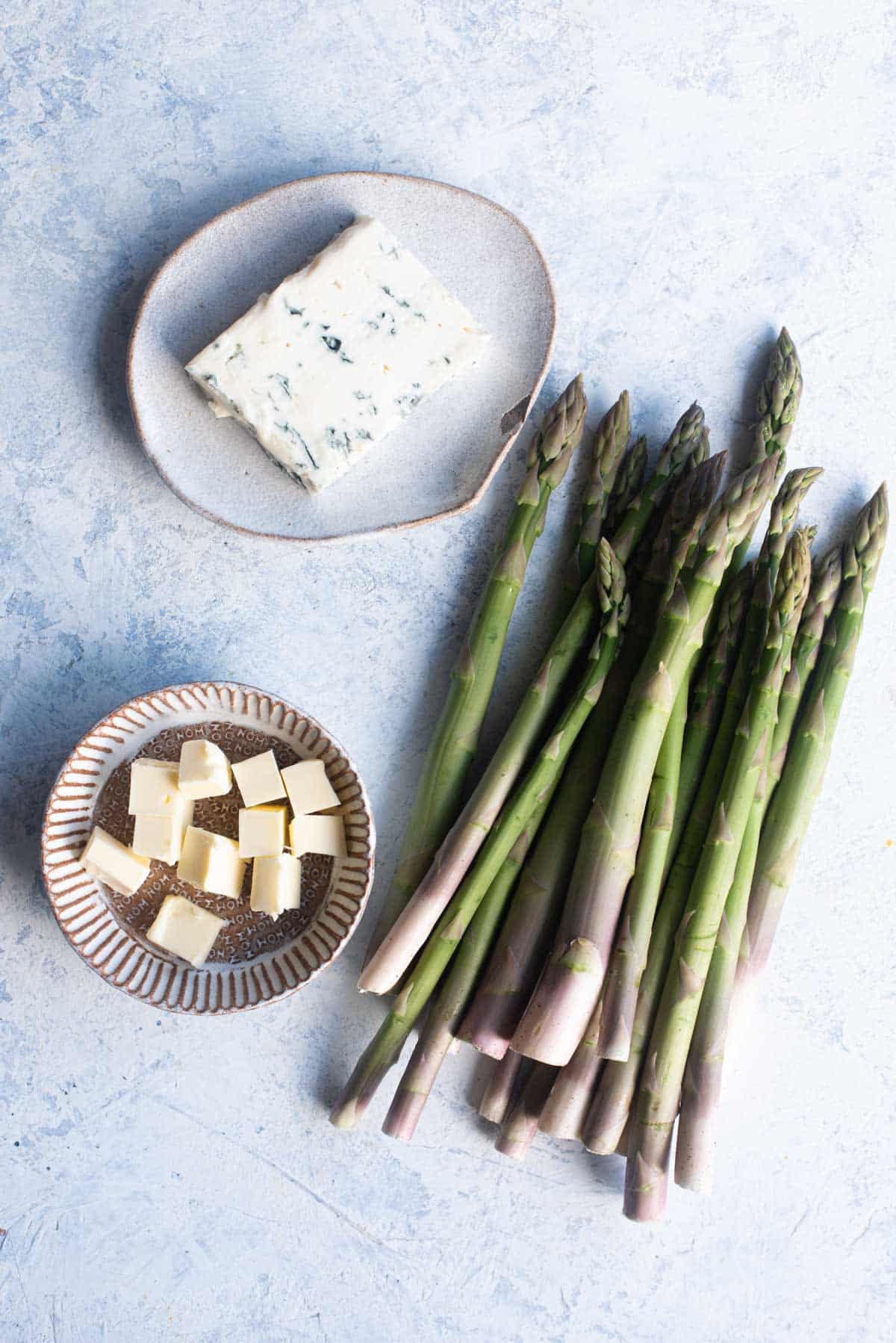 An overhead shot of all the ingredients needed to make our roasted asparagus with gorgonzola recipe.