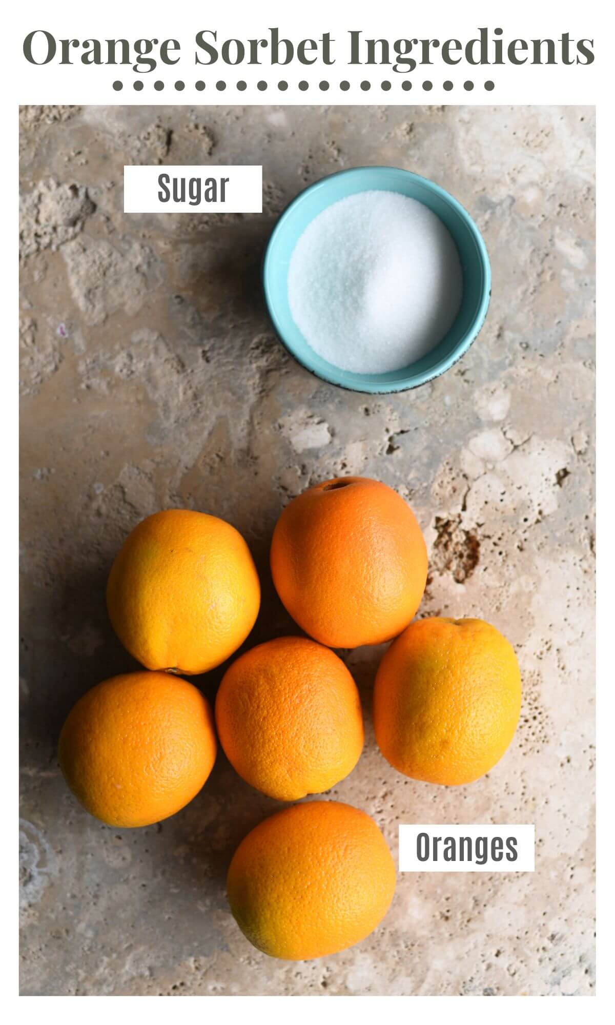 An overhead shot of all the ingredients you need to make orange sorbet (oranges and sugar).