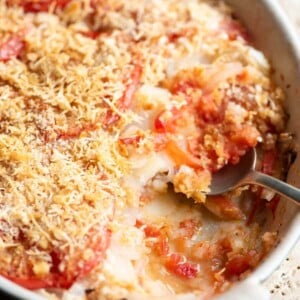A close up cropped image of an Italian potato and tomato gratin.