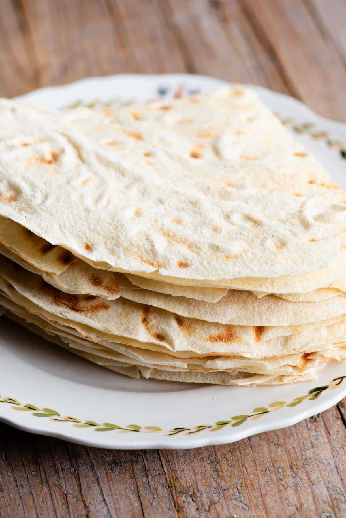 A close up of Pane Carasau piled high on. aplate.
