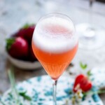 A close up cropped image of a rossini cocktail.
