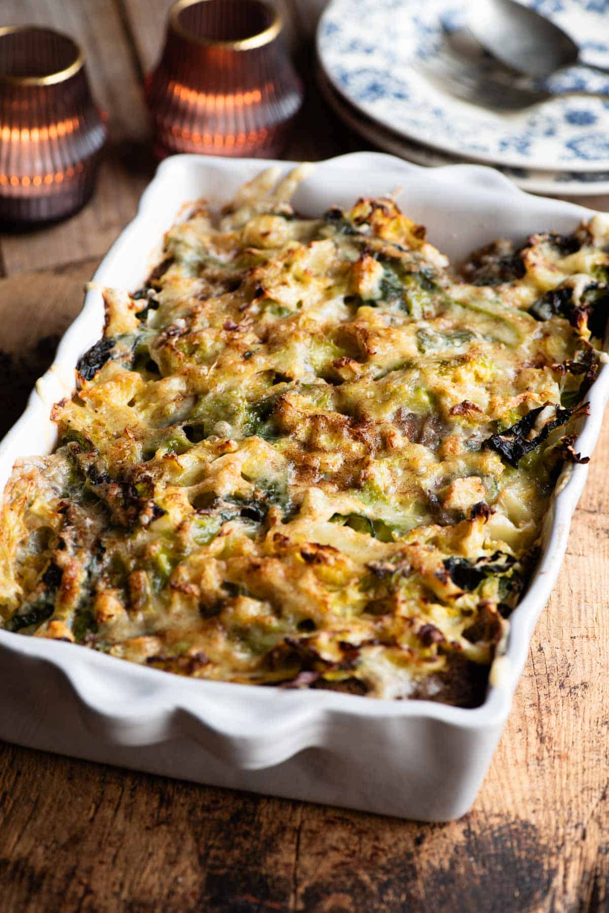 Zuppa Valpellinese in a baking dish sitting on a rustic wooden board.