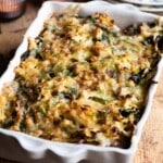 A clos eup cropped image of a cheese and cabbage casserole in a baking dish.