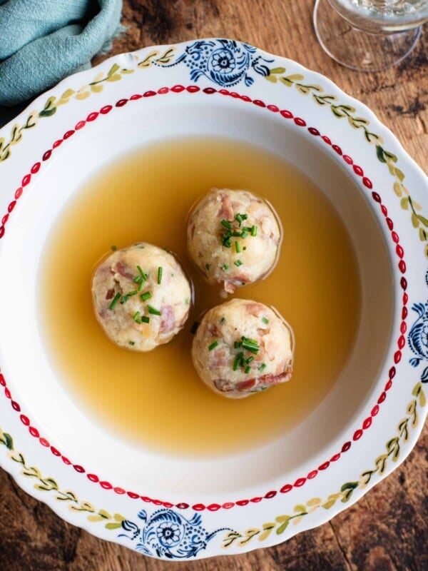 An overhead shot of Canederli, Italian bread dumplings in broth.