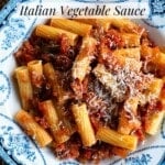 A Pinterest graphic of a bowl of rigatoni pasta with a vegetable sauce sitting on a wooden background.