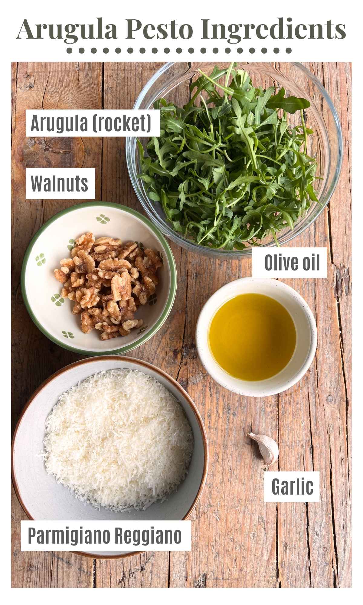 An overhead shot of all the ingredients needed to make arugula pesto.