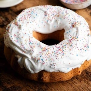 A close up of an Italian Easter bundt cake topped with meringue and sprinkles.