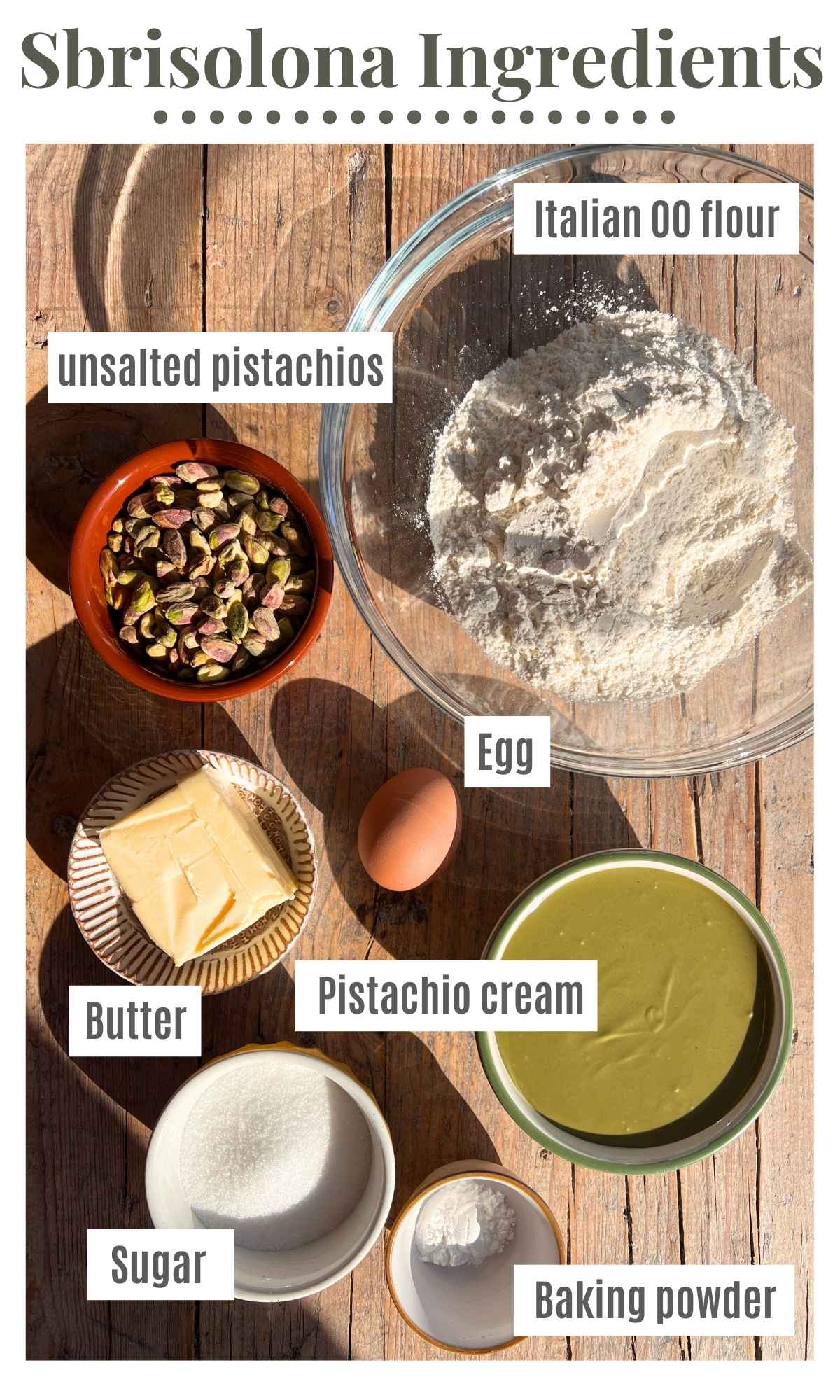 All the ingredients for an Italian pistachio crumb cake in bowls; flour, pistachios, butter, egg, sugar, baking powder and pistachio cream.