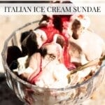 A close-up of an Italian ice cream sundae called Paciugo, served in a vintage glass dessert dish. The sundae features swirls of creamy gelato, cherry sauce, and chocolate, with a spoon resting inside the dish. Text overlay reads “Paciugo – Italian Ice Cream Sundae.
