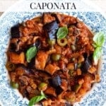Sicilian eggplant caponata in a blue and white bowl sitting on a travertine surface. The text overlay reads: Traditional Sicilian Caponata.