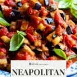A pinterest graphic showing a close up of fried eggplant in tomato sauce. The text overlay reads: Neapolitan Fried Eggplant - Authentic recipe.