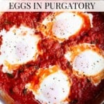 Four poached eggs in a tomato sauce. The text overlay reads: Spicy Nduja Eggs in Purgatory.