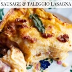 A slice of butternut squash lasagna on a floral plate. The text overlay reads: Butternut Squash Sausage and Taleggio Lasagna.