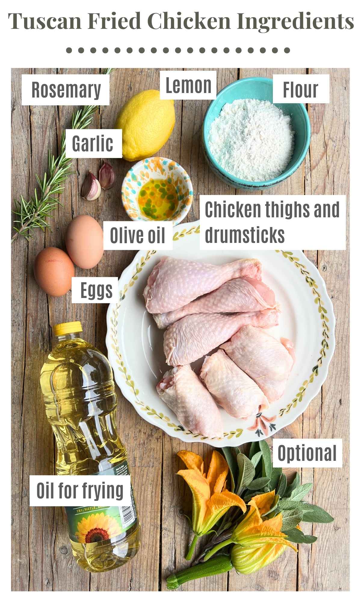 All the ingredients needed to make Tuscan fried chicken laying on a rustic wooden surface.