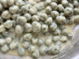 A close up of the creamy parmigiano and butter sauce with gnocchette.