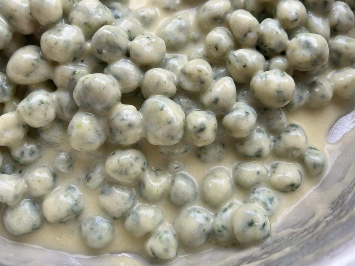 A close up of the creamy parmigiano and butter sauce with gnocchette.