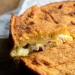 A close up of a Neapolitan potato cake stuffed with meat and cheese and topped with golden breadcrumbs.