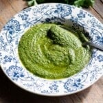 A close up of Tuscan salsa verde in a blue floral plate.