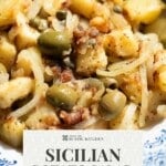 A pinterest graphic showing a close up of a Sicilian potato salad with olives and capers.