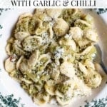 An overhead shot showing broccoli pasta in a green and white bowl with a text overlay that reads' Easy Broccoli Pasta with Garlic and Chilli.