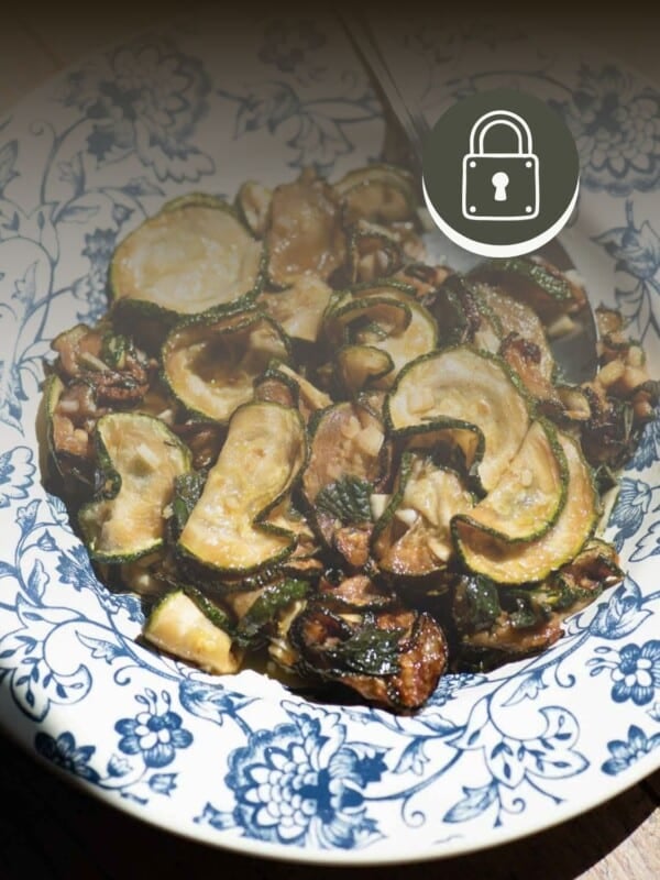 Zucchine alle scapece in a bowl with a padlock sign at the top to signify a member only recipe.