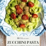 A pinterest graphic showing a zucchini pasta with roasted tomatoes. The text overlay reads; Zucchini Pasta slow roasted toamtoes - get the recipe.