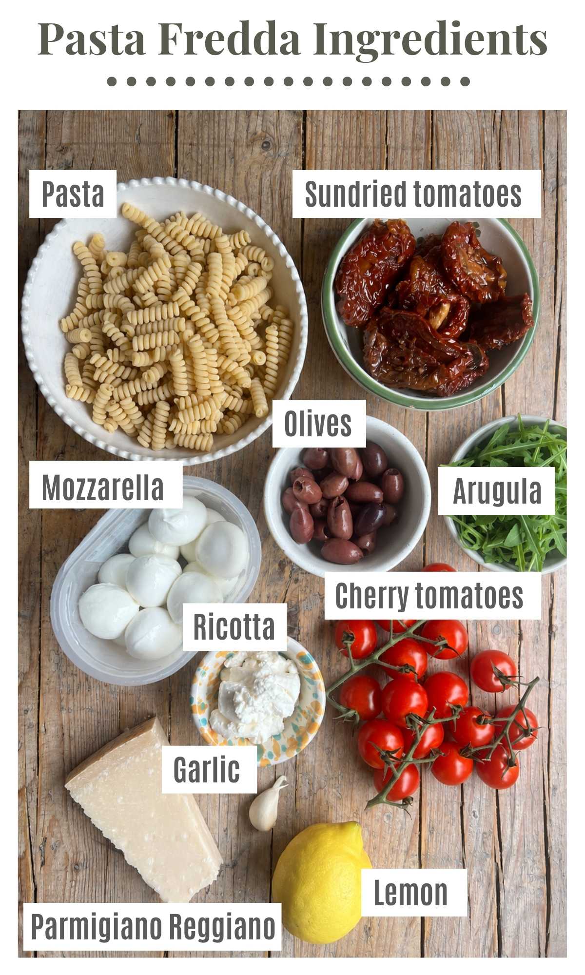An overhead shot of all the ingredients needed to make a sundried tomato pasta salad.