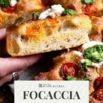 A pinterest graphic showing a close up of a roasted tomato focaccia with pesto and burrata.
