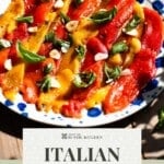 A pinterest graphic showing marinated red and yellow bell peppers on a blue speckled plate. The text overlay reads; Italian Marinated Peppers - get the recipe.