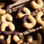 A close up cropped image of Italian abbracci cookies on a cooling rack.