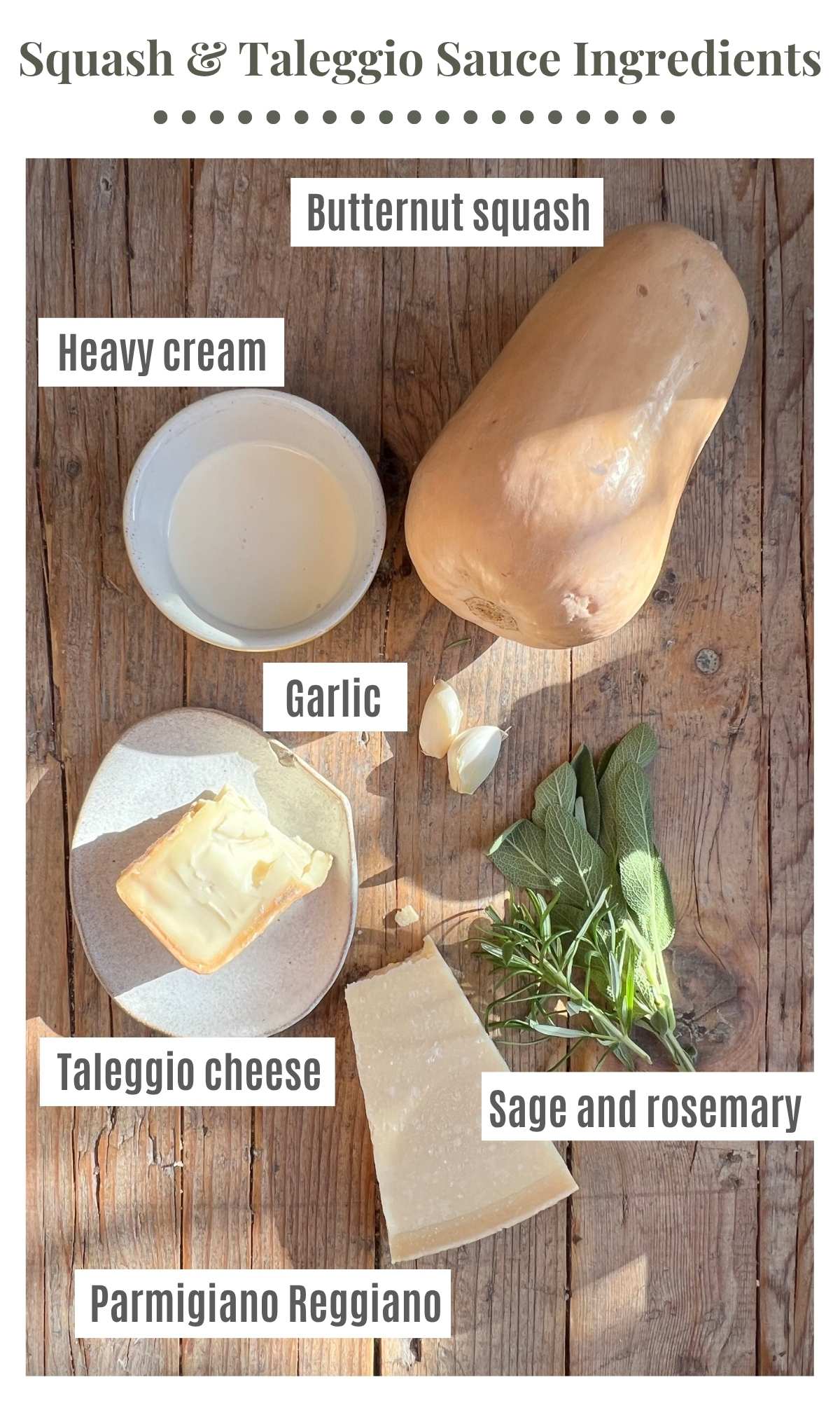 An overhead shot of butternut squash, taleggio, garlic, rosemary, sage, parmigiano cheese and heavy cream on a rustic wooden surface.