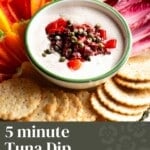 A pinterest graphic of a tuna dip on a platter with vegetables. The text overlay reads; 5 minute tuna dip with capers, peppers and olives.